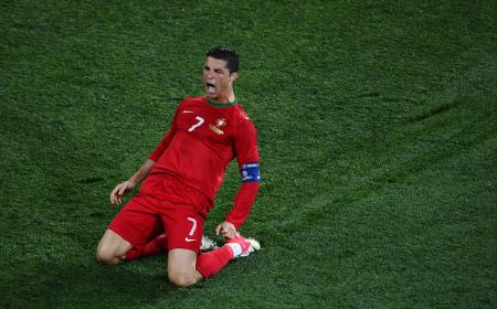 KHARKOV, UKRAINE - JUNE 17: Cristiano Ronaldo of Portugal celebrates scoring his team's second goal during the UEFA EURO 2012 group B match between Portugal and Netherlands at Metalist Stadium on June 17, 2012 in Kharkov, Ukraine. (Photo by Lars Baron/Getty Images)