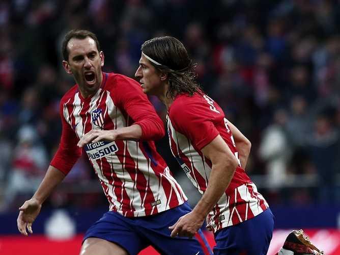 Godin + Filipe Luis zimbio