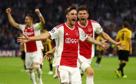 AMSTERDAM, NETHERLANDS - SEPTEMBER 19: Nicolas Tagliafico of Ajax celebrates after scoring his team's first goal during the Group E match of the UEFA Champions League between Ajax and AEK Athens at Johan Cruyff Arena on September 19, 2018 in Amsterdam, Netherlands. (Photo by Dean Mouhtaropoulos/Getty Images)