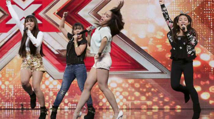 *** MANDATORY BYLINE TO READ: Syco / Thames / Corbis *** X Factor contestants are seen on stage for the first show of the 2015 series. Pictured: 4th Power Ref: SPL1112374 200715 Picture by: Dymond/Syco/Thames/Corbis