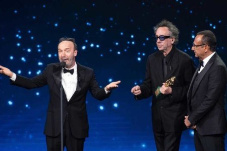US film director Tim Burton (C) with Italian film director and actor Roberto Benigni and Italian presenter Carlo Conti (R) on stage in the occasion of the 64th edition of the ?David di Donatello Awards? in Rome, Italy, 27 March 2019. The David di Donatello award is a film prize presented annually to honor the best of Italian and foreign motion picture productions.
ANSA/CLAUDIO PERI