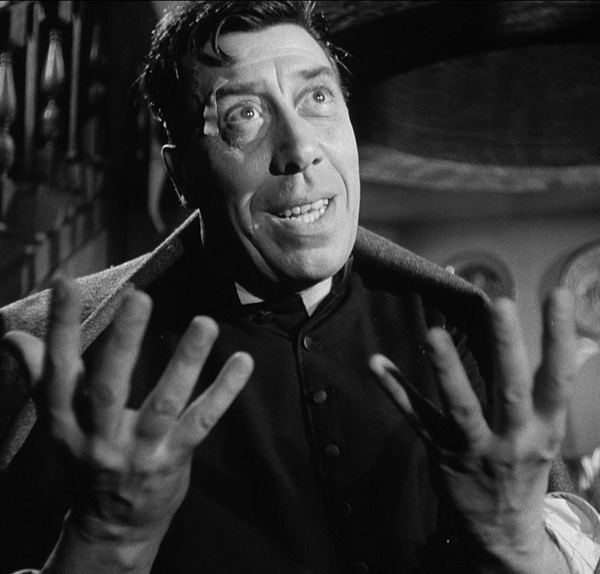 Il prete che benedice a schiaffi