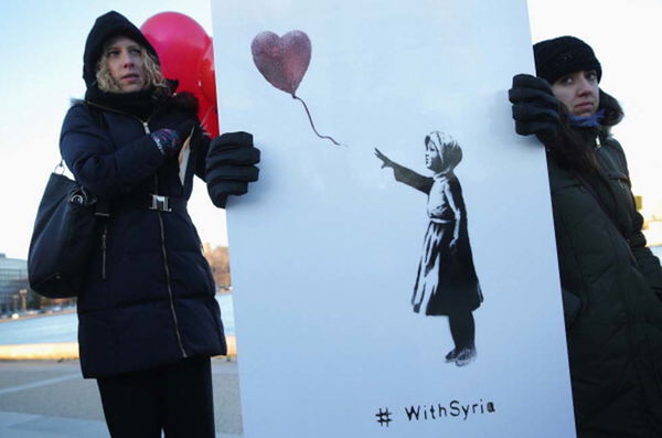 La «Ragazza con il palloncino rosso» di Banksy chiede la pace in Siria