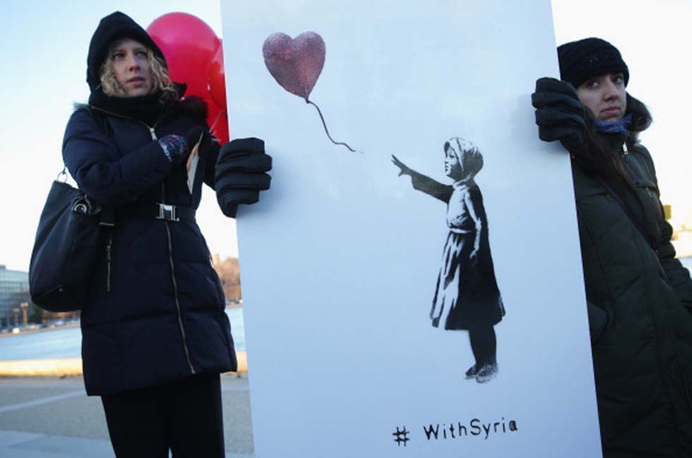 La «Ragazza con il palloncino rosso» di Banksy chiede la pace in Siria article-post