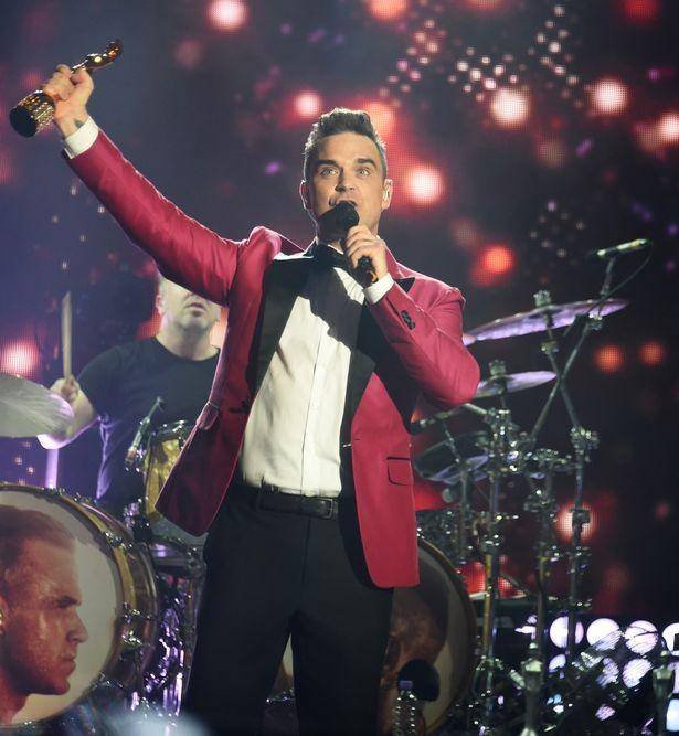 brits-icon-award-presented-to-robbie-williams-show-backstage